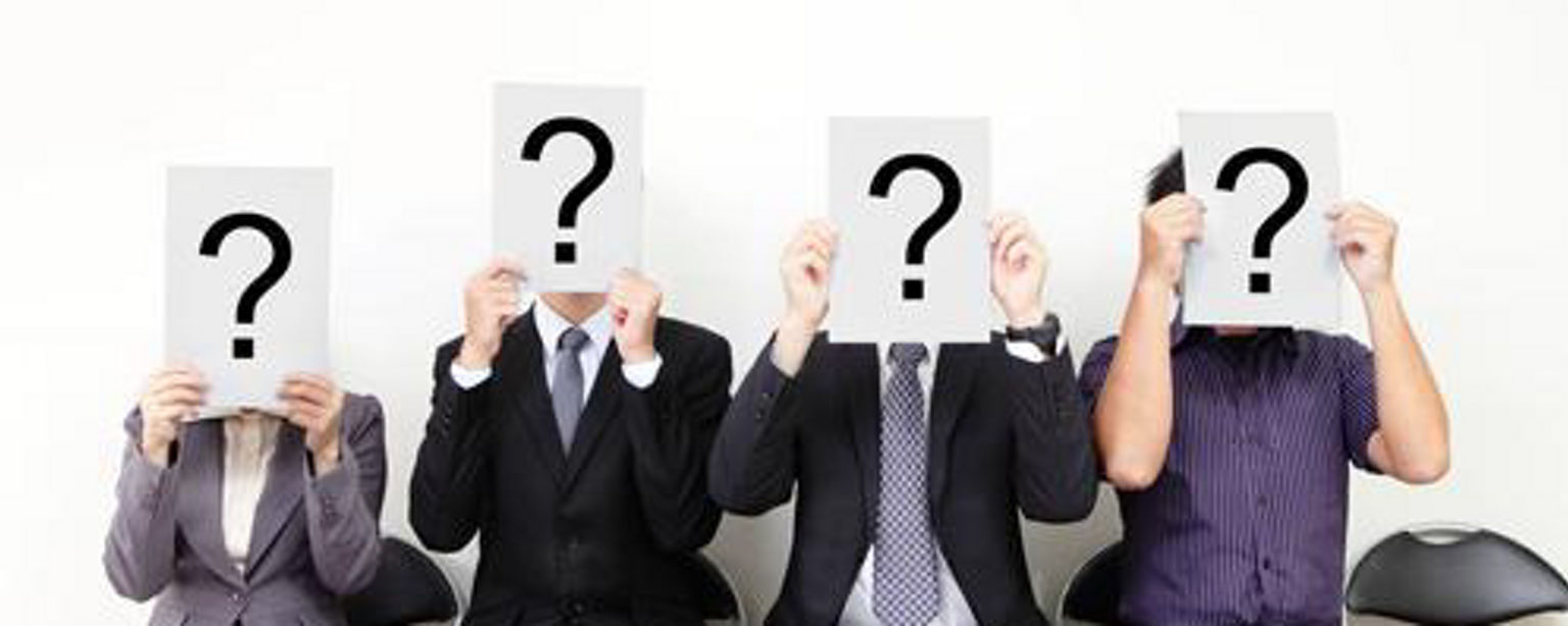 Job applicants holding question marks to ask in interview